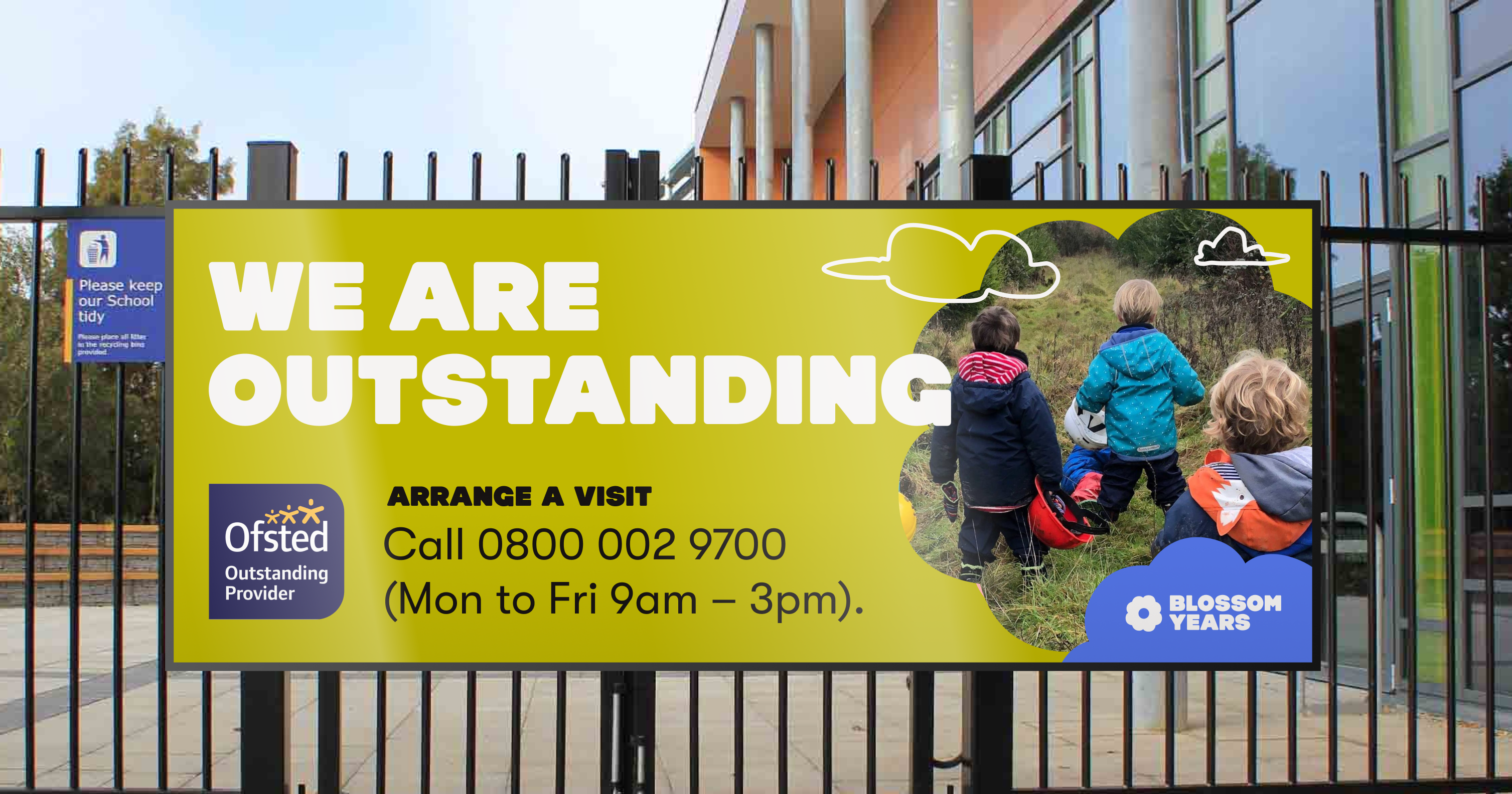 A. mockup of an external sign on school gates with the text "We are outstanding" relating to a recent Ofsted rating.