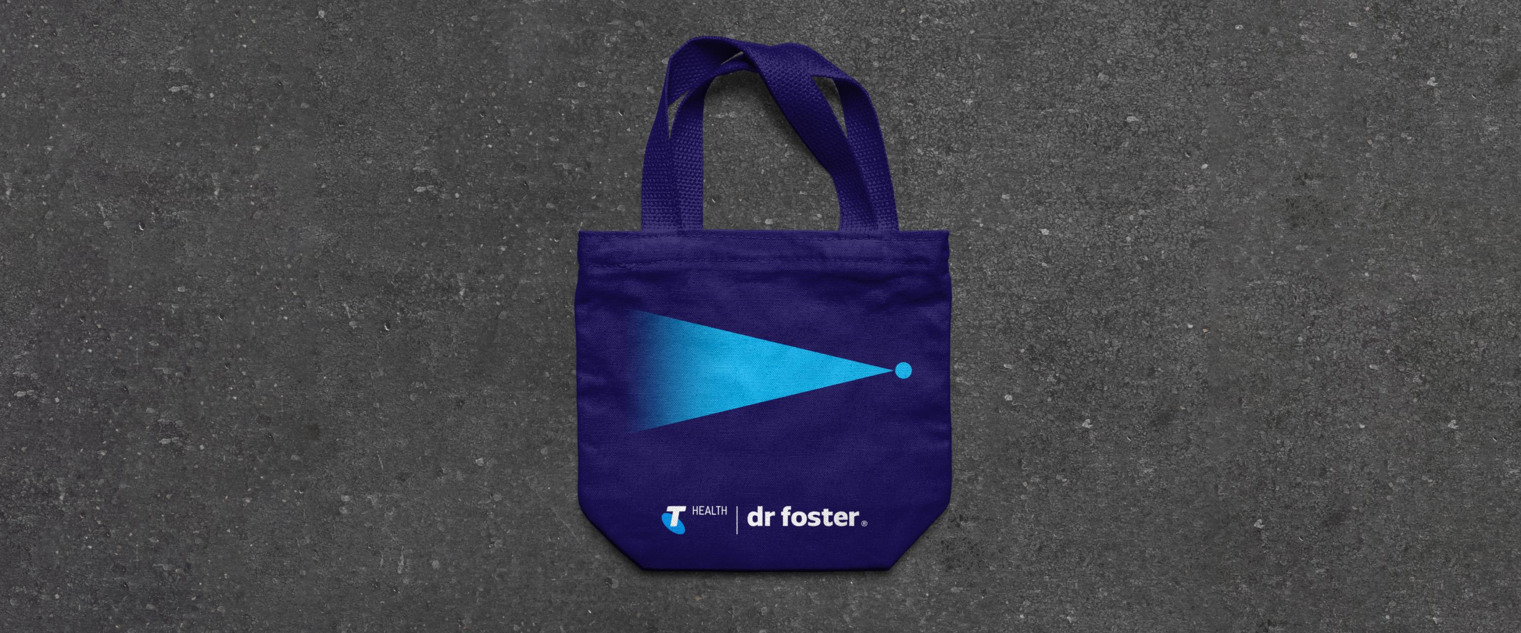 Mockups of a tote bag showcasing the brand