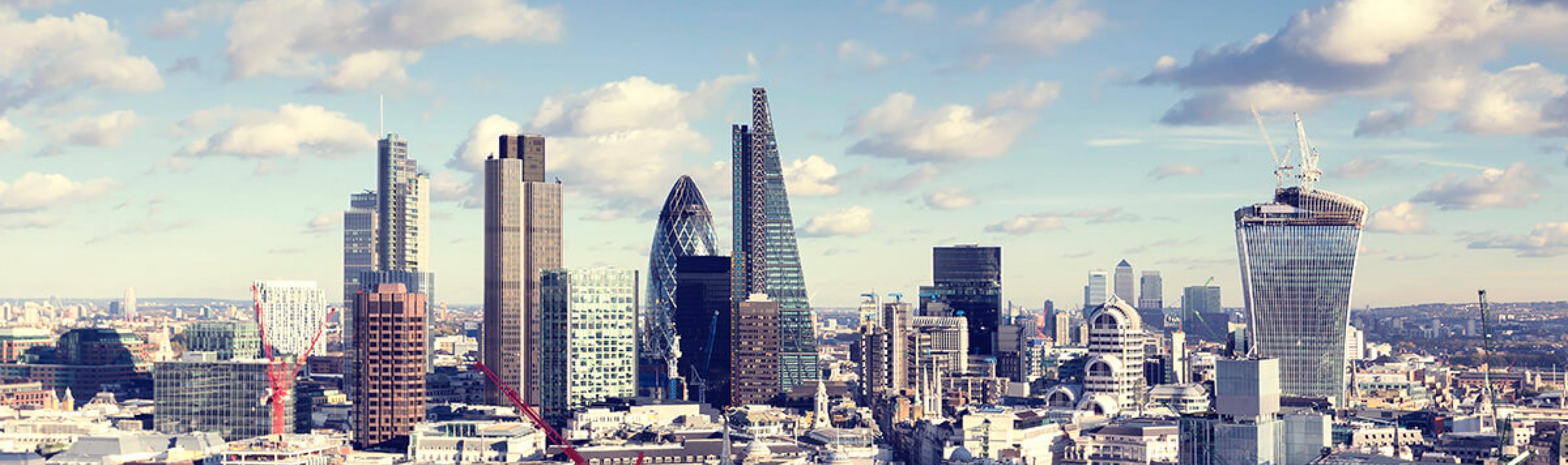 a photo of london skyline with the gherkin in the centre
