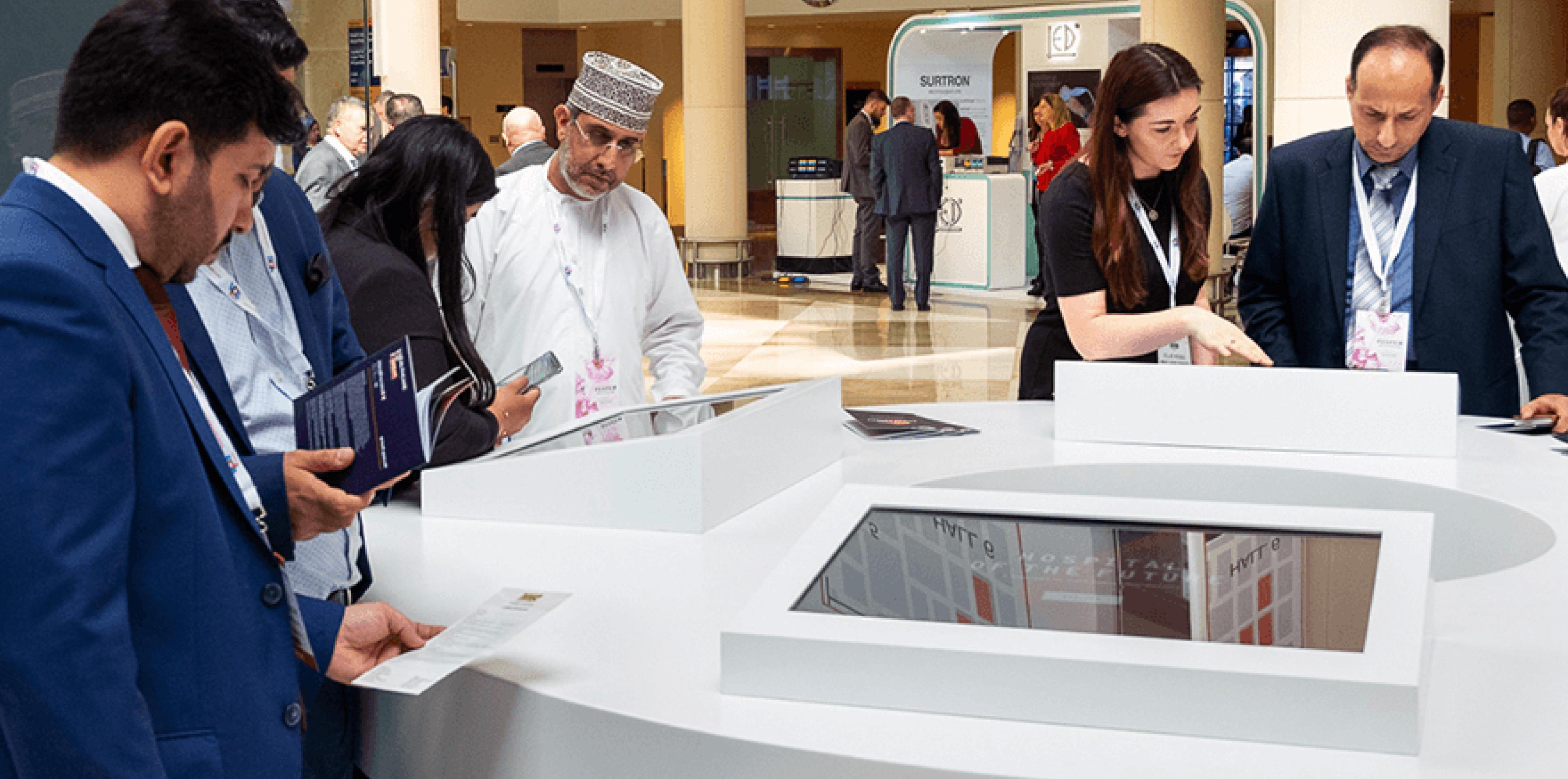 a photo from the healthcare event with people standing around the popup