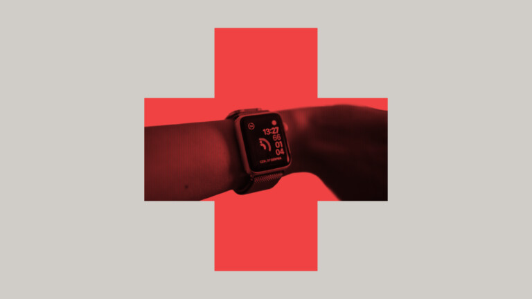 smartwatch on a wrist inside a red cross