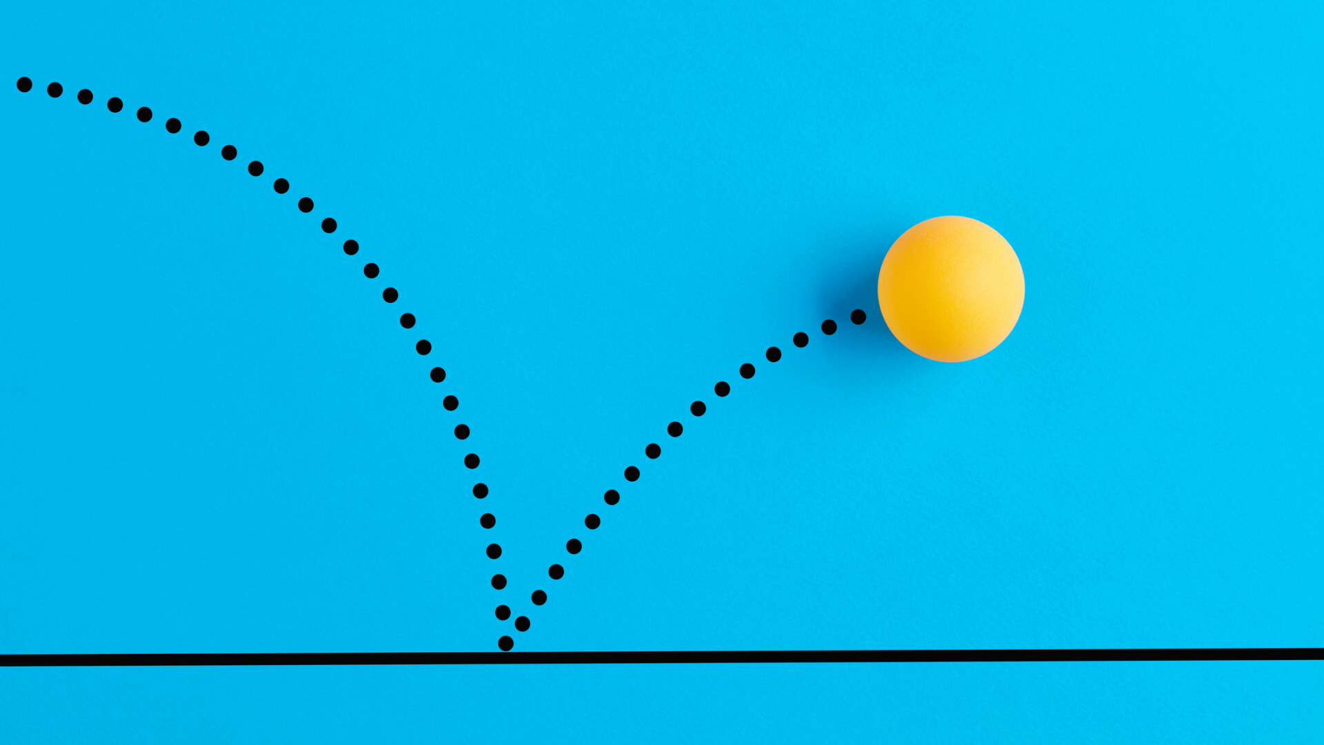 yellow bouncing ball against a blue background